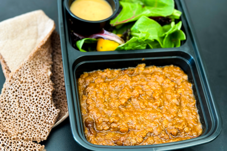 Ethiopian vegan stew with salad and injera