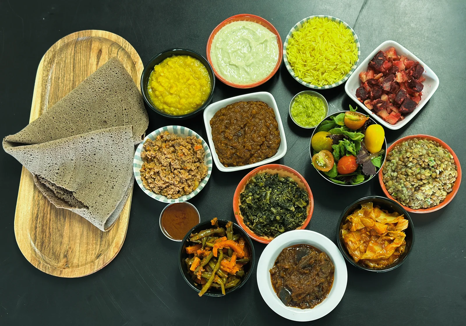 GIHON Ethiopian combo plate with injera and assorted sides